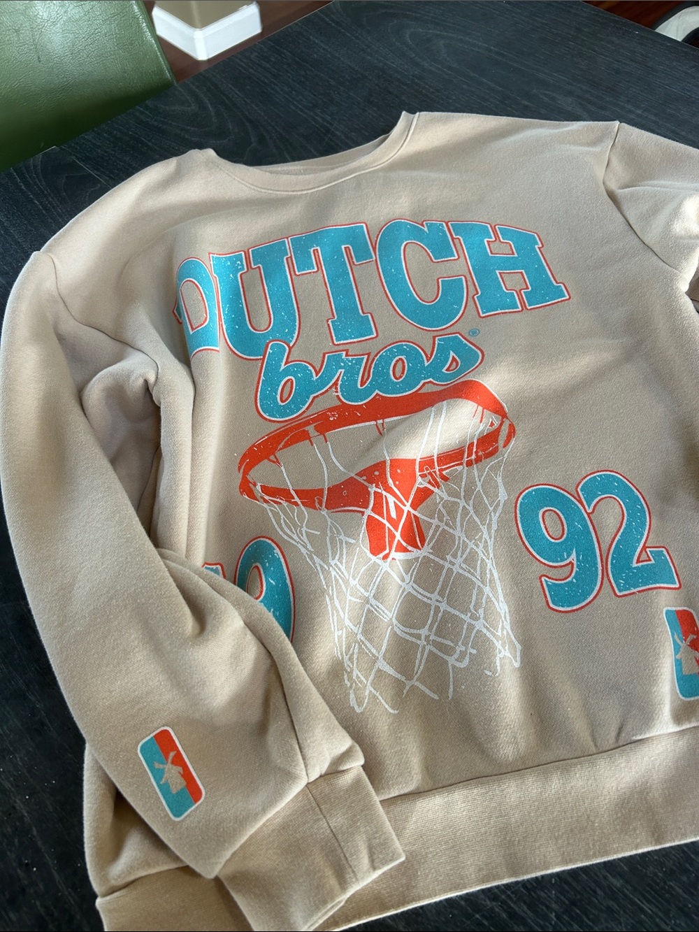 Dutch Bros Tan Crewneck with Teal & Orange Basketball Graphic